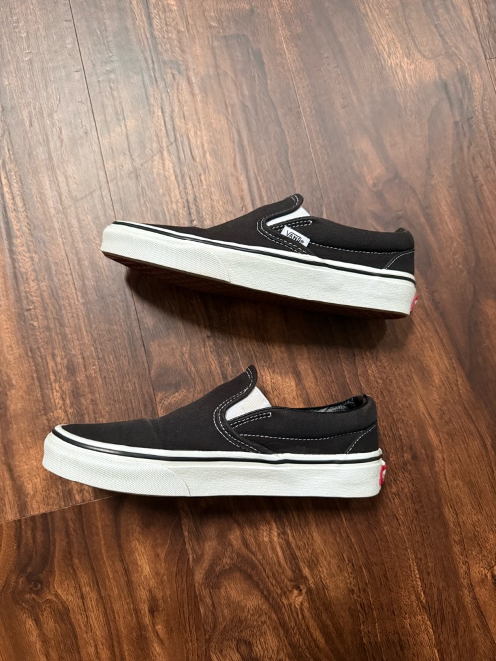 Vans Black and White Slip-On Sneakers
